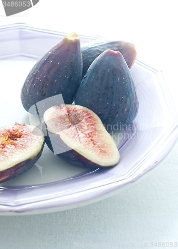 Image of Group of colored figs on the colorful background