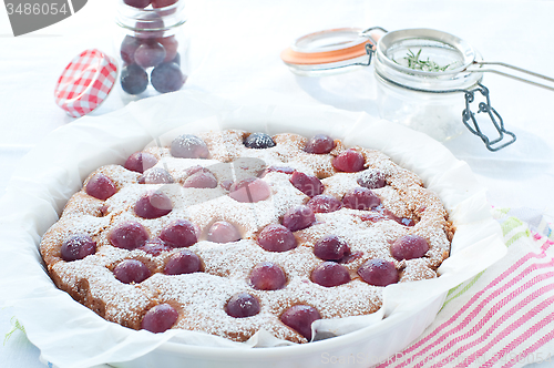Image of Fresh cake with red grape season and icing sugar