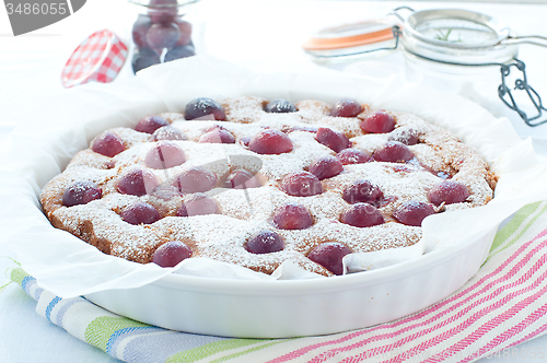 Image of Fresh cake with red grape season and icing sugar