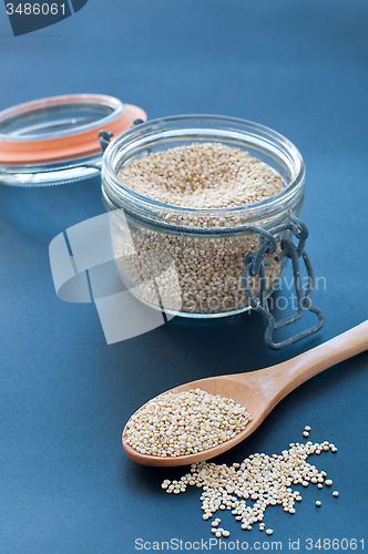 Image of Filling a glass of quinoa grain from the Andes