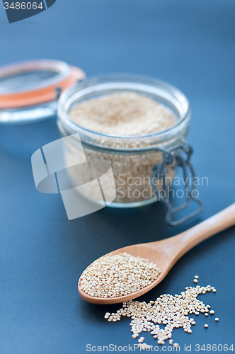 Image of Filling a glass of quinoa grain from the Andes