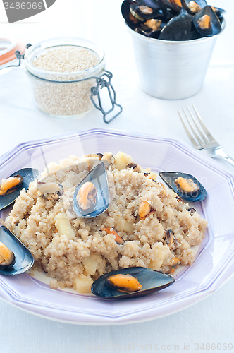 Image of Warm quinoa salad with mussels, tomatoes and potatoes