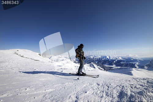 Image of Skier on top of ski slope