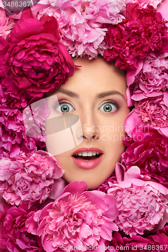 Image of Woman face in peony flowers