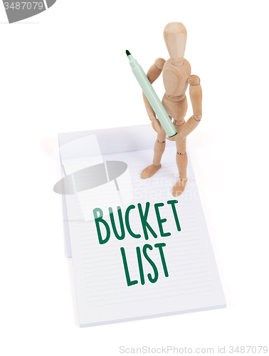 Image of Wooden mannequin writing - Bucket list