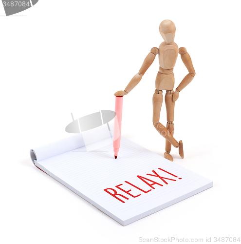 Image of Wooden mannequin writing - Relax