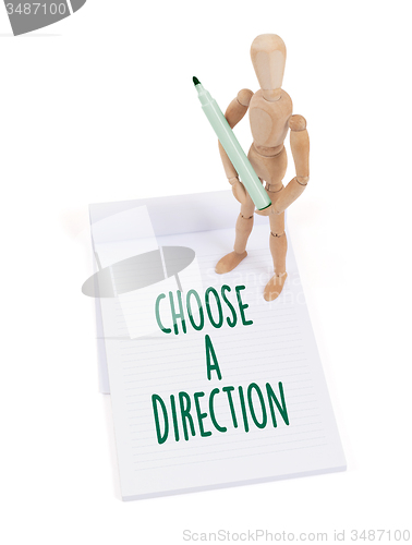 Image of Wooden mannequin writing - Choose a direction