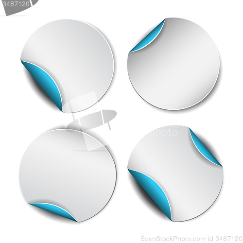 Image of Set of white round stickers with blue backside.