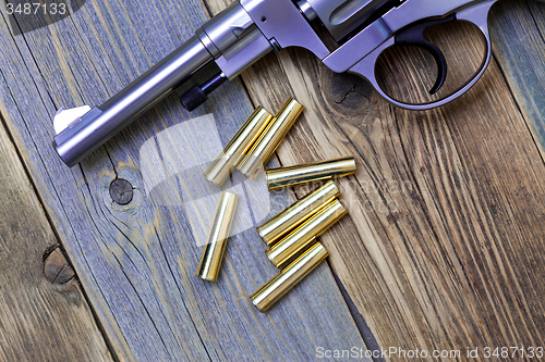 Image of Nagan revolver with cartridges