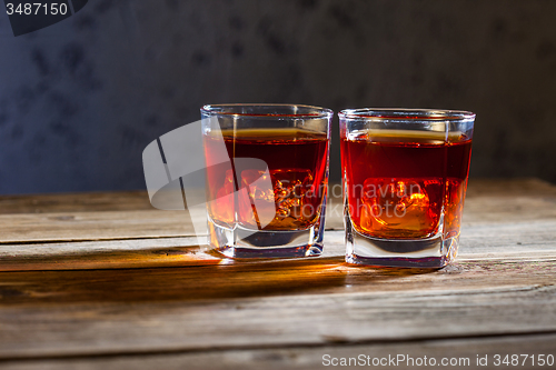 Image of two glasses of old whiskey