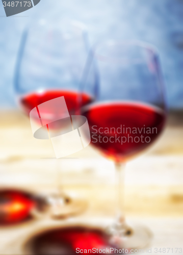 Image of red wine in two goblets. romantic blur