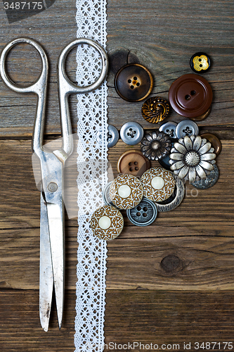 Image of vintage buttons, lace, and a dressmaker scissors