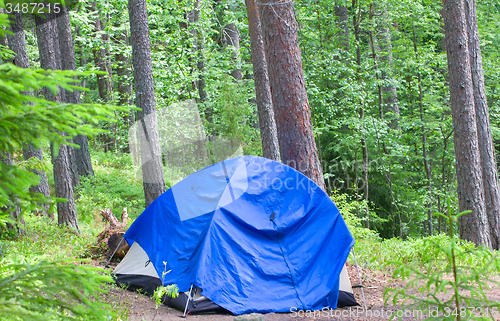 Image of camping outdoor with  tent in woods in summer 