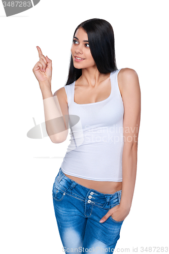 Image of Casual woman pointing at white background
