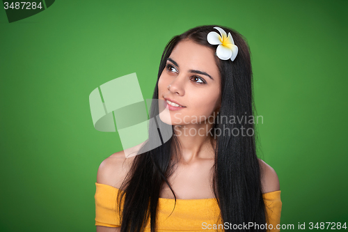 Image of Teen female with Plumeria Flower