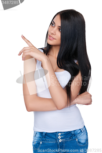 Image of Casual woman pointing at white background