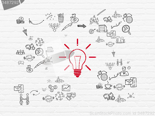 Image of Finance concept: Light Bulb on wall background