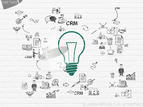 Image of Business concept: Light Bulb on wall background