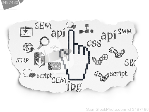 Image of Web development concept: Mouse Cursor on Torn Paper background
