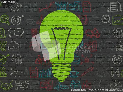 Image of Finance concept: Light Bulb on wall background