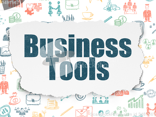 Image of Finance concept: Business Tools on Torn Paper background