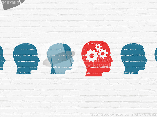Image of Business concept: head with gears icon on wall background
