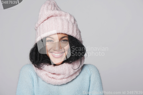 Image of Laughing mixed race winter woman