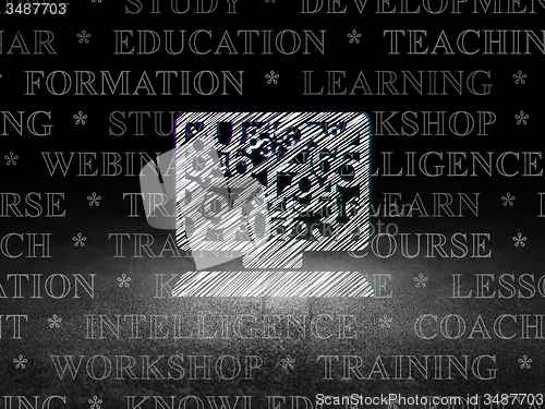 Image of Education concept: Computer Pc in grunge dark room