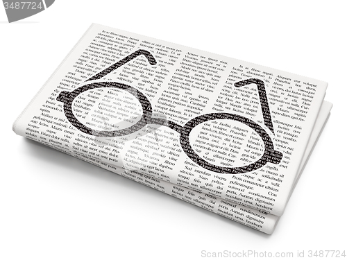 Image of Studying concept: Glasses on Newspaper background
