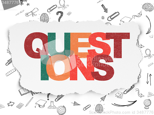 Image of Learning concept: Questions? on Torn Paper background
