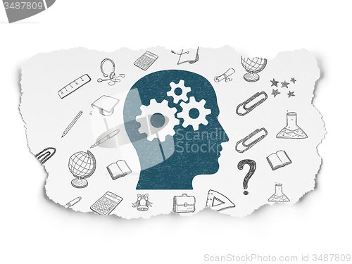 Image of Learning concept: Head With Gears on Torn Paper background