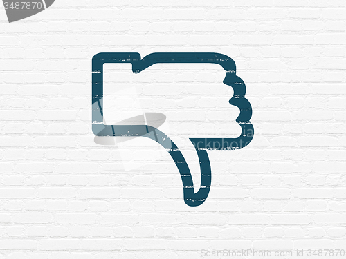 Image of Social network concept: Thumb Down on wall background