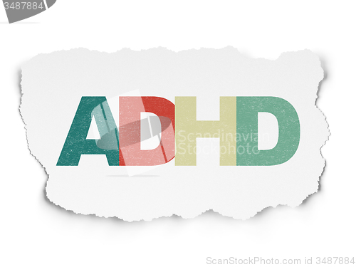 Image of Medicine concept: ADHD on Torn Paper background