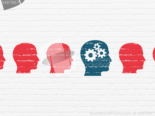 Image of Studying concept: head with gears icon on wall background