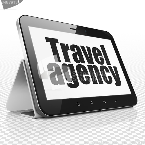 Image of Vacation concept: Tablet Computer with Travel Agency on display