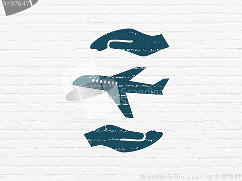 Image of Insurance concept: Airplane And Palm on wall background