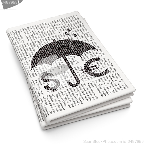 Image of Insurance concept: Money And Umbrella on Newspaper background