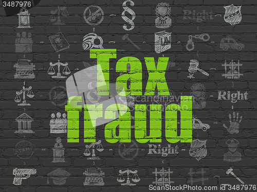 Image of Law concept: Tax Fraud on wall background