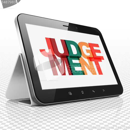 Image of Law concept: Tablet Computer with Judgement on  display