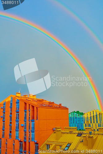 Image of Double rainbow over the city