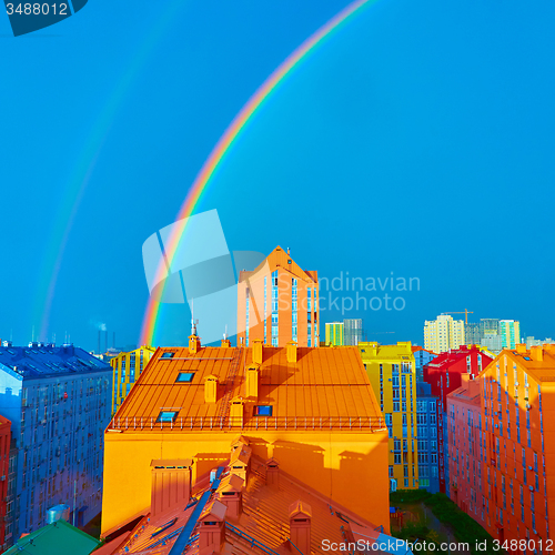 Image of Double rainbow over the city