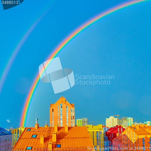 Image of Double rainbow over the city
