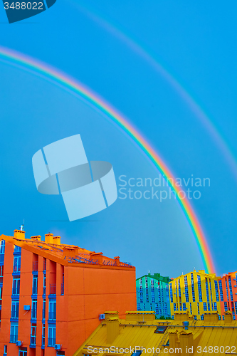 Image of Double rainbow over the city