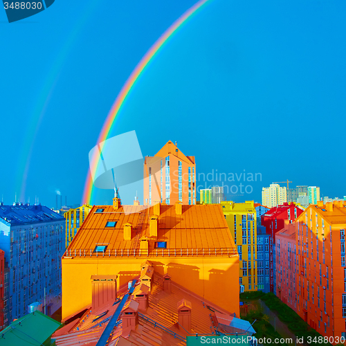 Image of Double rainbow over the city