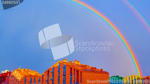 Image of Double rainbow over the city