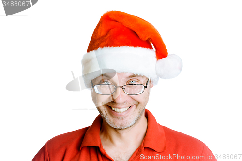 Image of Smiling happy unshaven man with glasses and a hat Santa