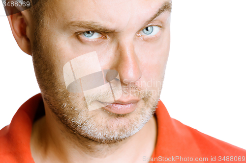 Image of strict unshaven man on a white background. close up