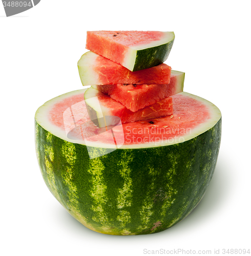 Image of Half of watermelon and slices on top