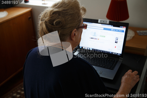 Image of retired person with computer