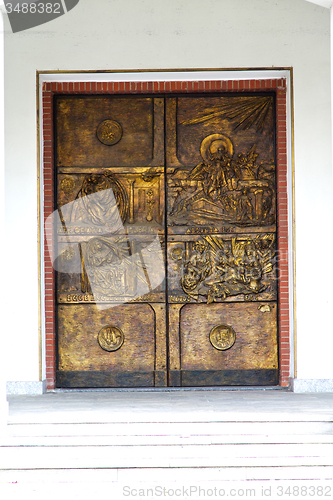 Image of abstract  church door    in italy  lombardy   column gold